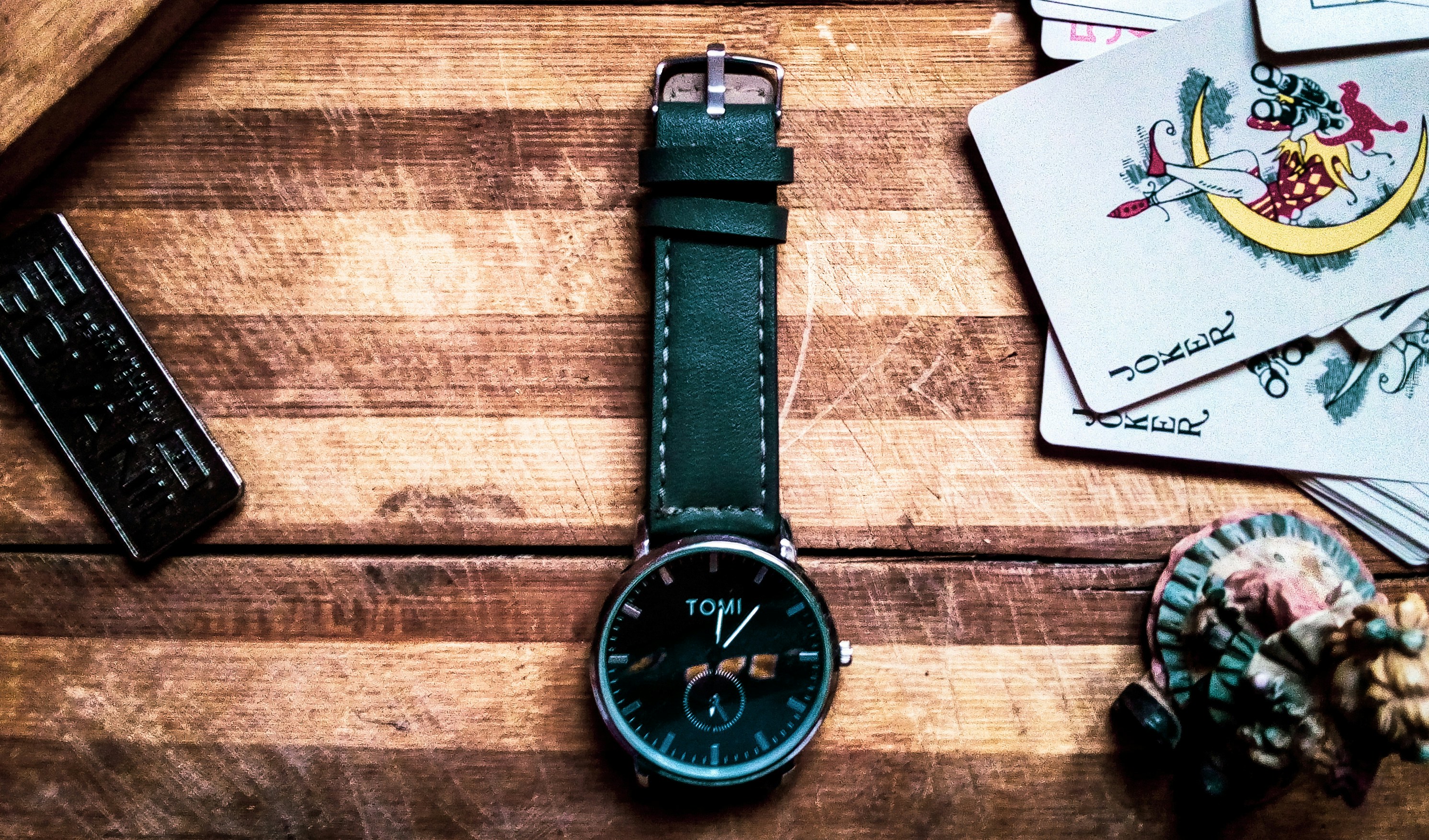 round black and silver-colored chronograph watch with black leather band